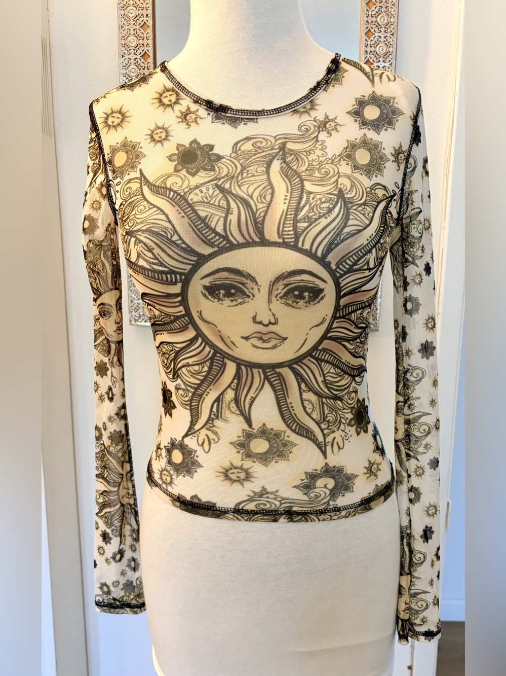 Urban Outfitters Vintage-Vibe Sun & Stars Print Mesh Long-Sleeve Crew Neck Top.